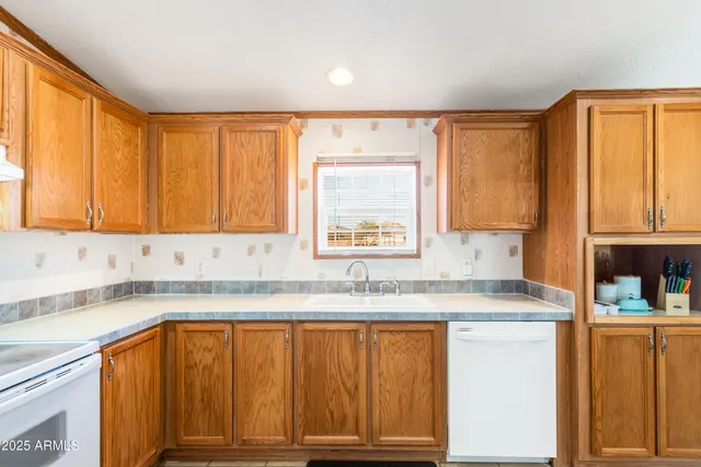 a bedroom with a bed dresser and a window