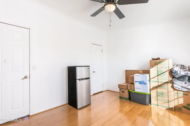 a view of room with furniture and wooden floor