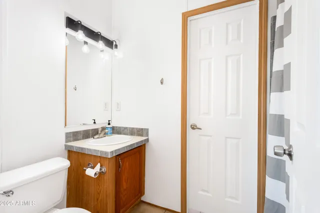 a bathroom with a bathtub and next to a window