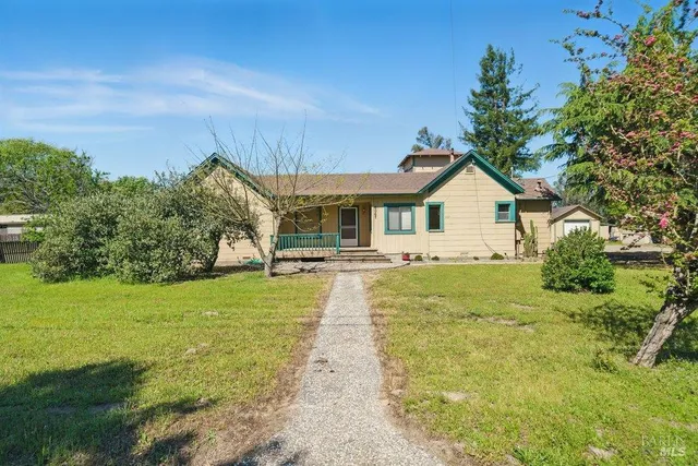 a backyard of a house with seating space