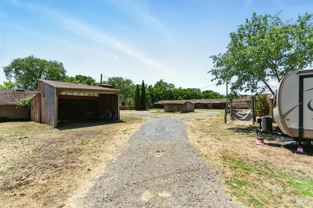 a house with swimming pool in front of it
