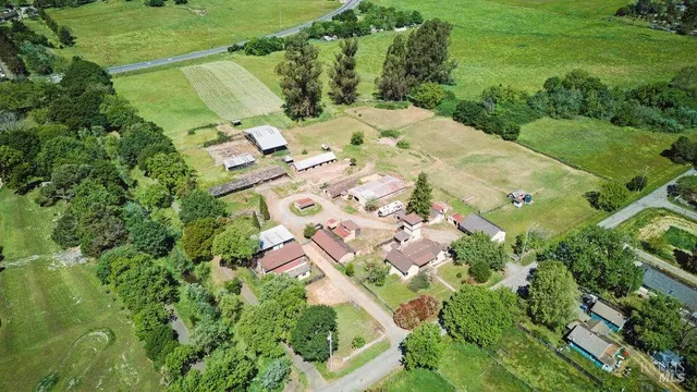 a view of a backyard with swimming pool