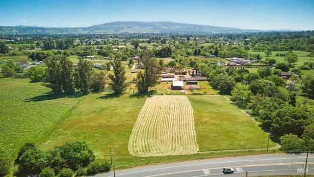 a view of a backyard with swimming pool