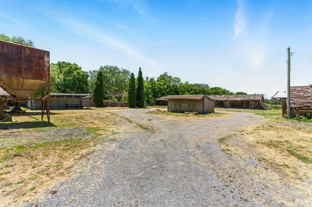 a swimming pool with yard in front of it