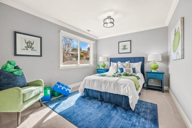 a bedroom with a bed and a couch