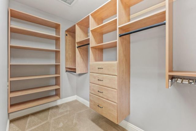 a view of an empty walk in closet