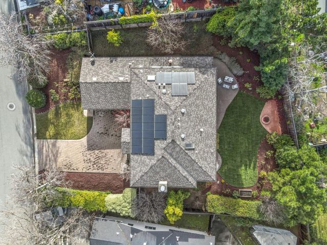 an aerial view of a house with a garden