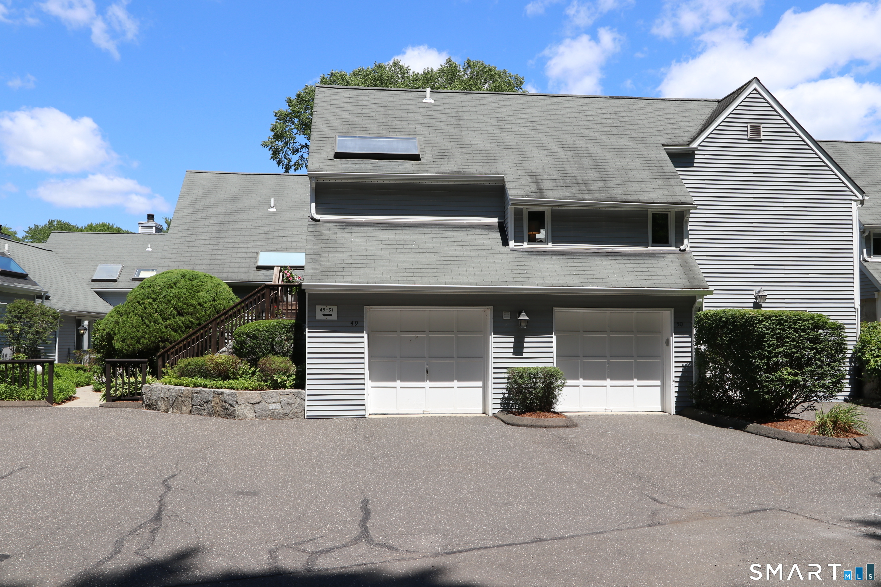 50 Wilton Crest Road, Unit 50 Wilton, CT 06897 - Photo 26 of 31 Unit number 50 garage is the right hand side garage, with additional parking in front