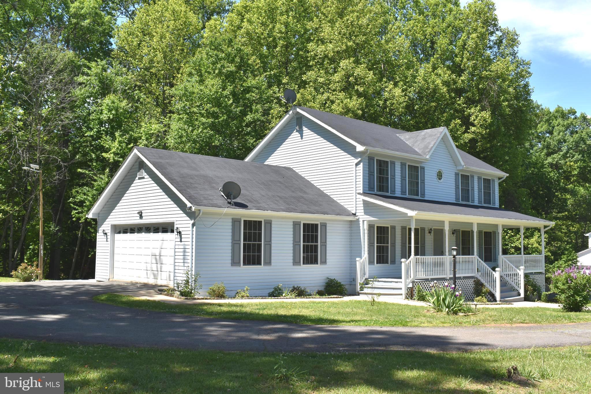 10958 Mountain Run Lake Road Culpeper, VA 22701 - Photo 26 of 31 a front view of a house with a yard and porch