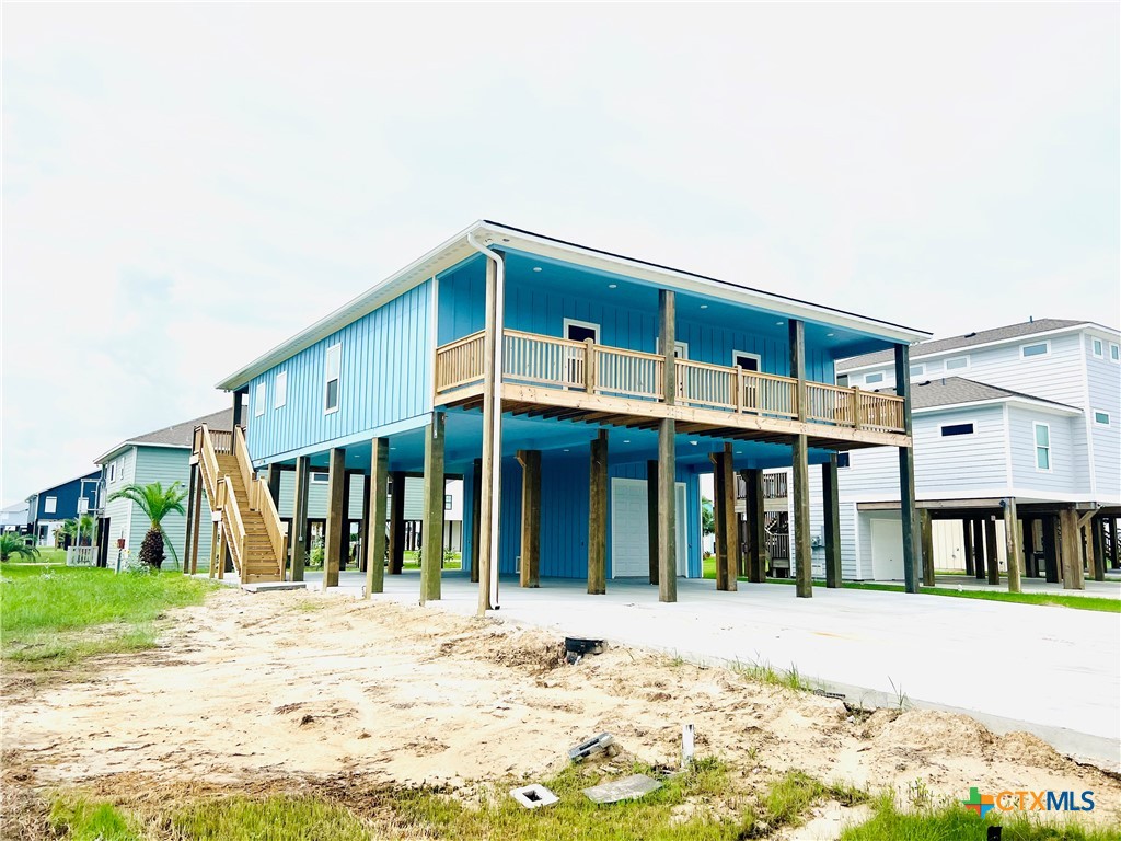116 Whooping Crane Street Port O'Connor, TX 77982 - Photo 34 of 38 a front view of a house with a yard