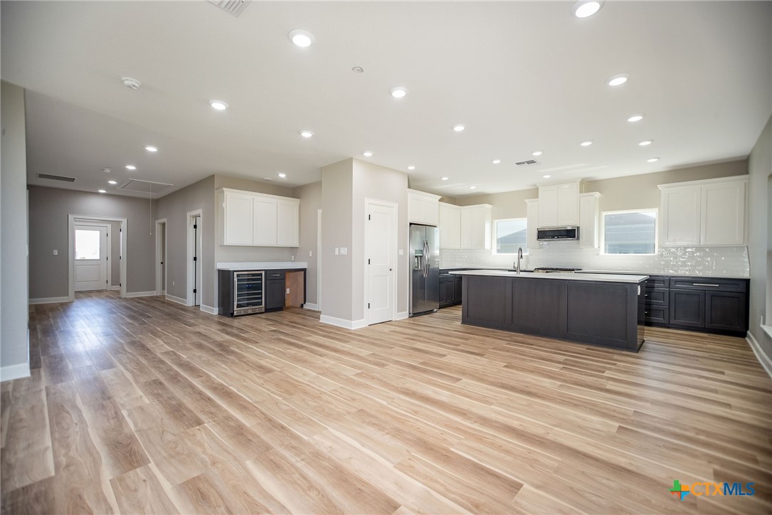116 Whooping Crane Street Port O'Connor, TX 77982 - Photo 8 of 38 a view of kitchen with kitchen island wooden floor center island and stainless steel appliances