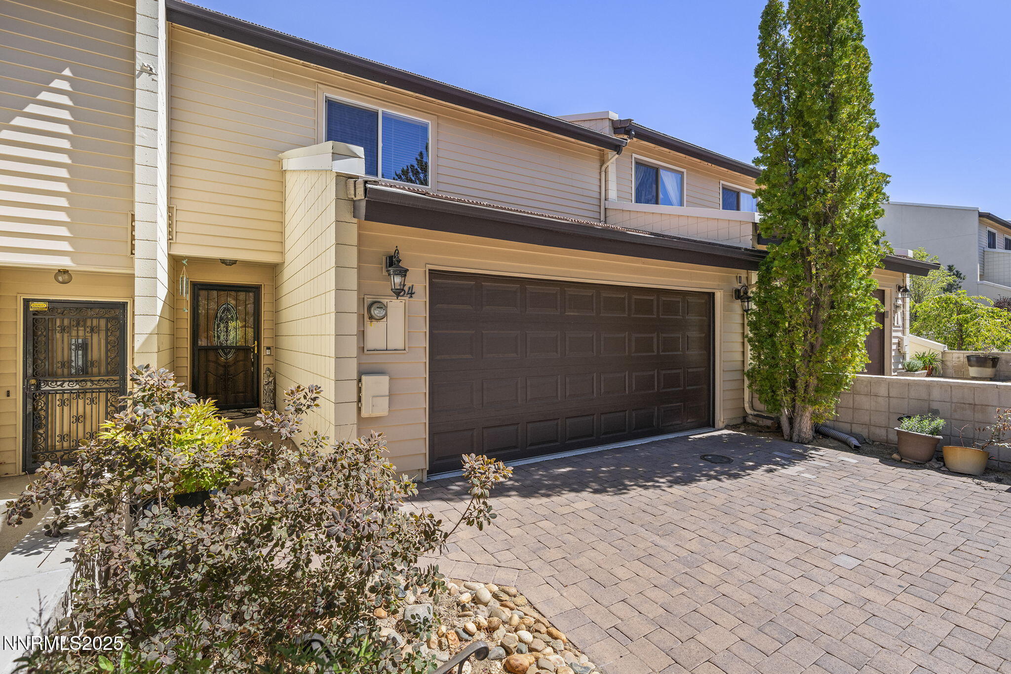 3601 Skyline Boulevard, Unit 34 Reno, NV 89509 - Photo 1 of 26 a front view of a house with a yard and garage