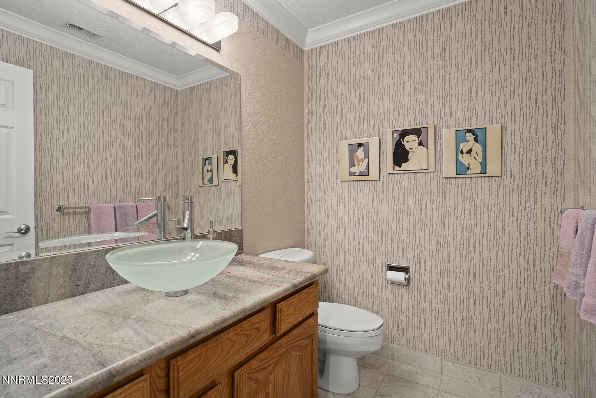 3601 Skyline Boulevard, Unit 34 Reno, NV 89509 - Photo 12 of 26 a bathroom with a granite countertop sink a toilet and a mirror