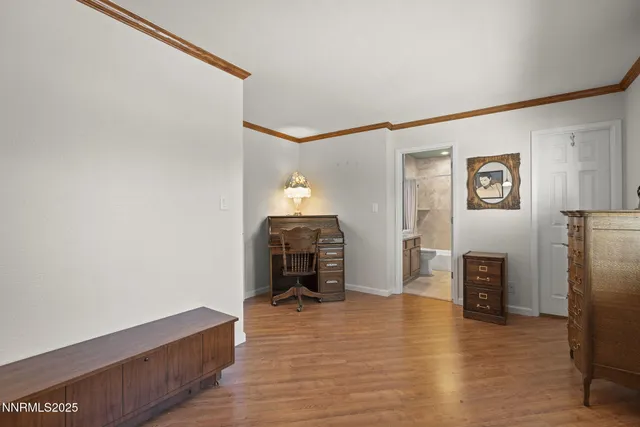 a view of a livingroom with furniture and an empty room