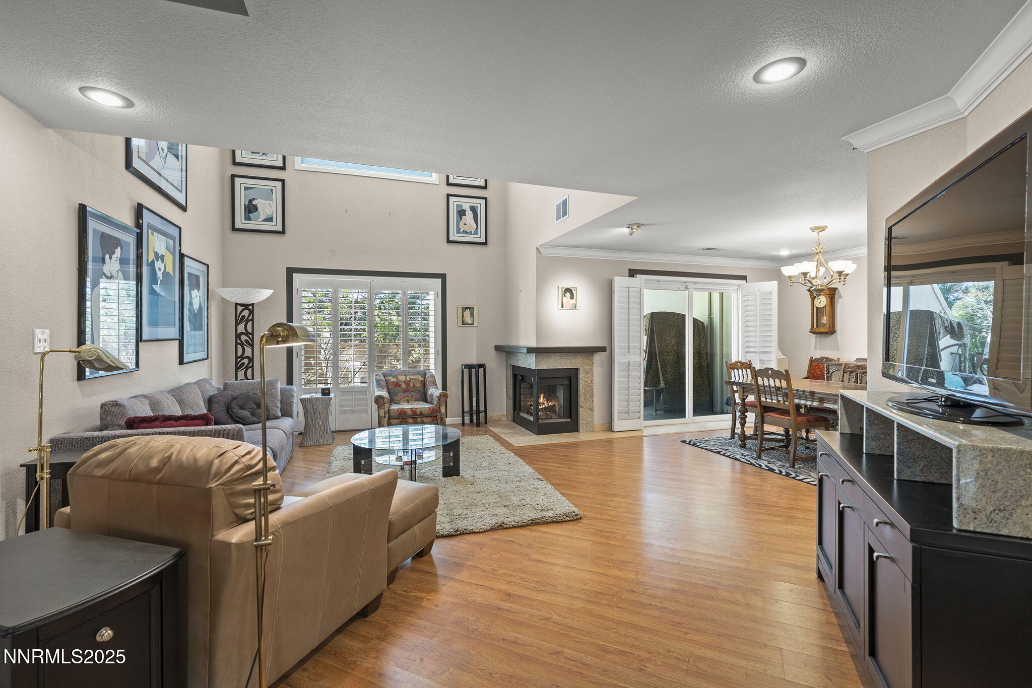 3601 Skyline Boulevard, Unit 34 Reno, NV 89509 - Photo 4 of 26 a living room with furniture wooden floor and a fireplace