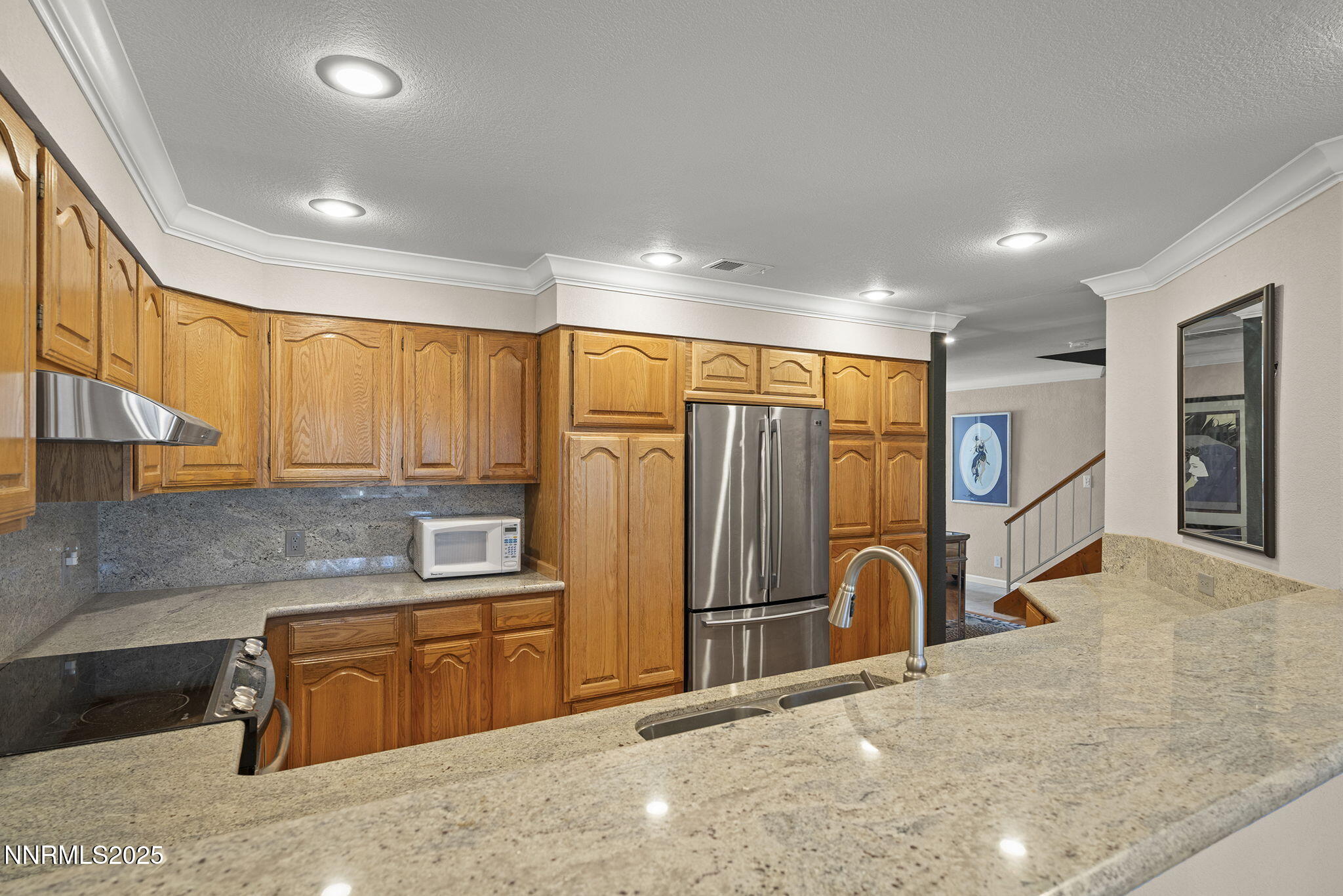 3601 Skyline Boulevard, Unit 34 Reno, NV 89509 - Photo 10 of 26 a view of a kitchen with a sink and a refrigerator