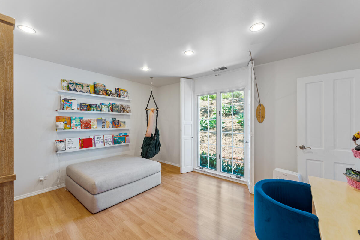 1020 Alston Road Montecito, CA 93108 - Photo 29 of 35 a living room with furniture and a book shelf