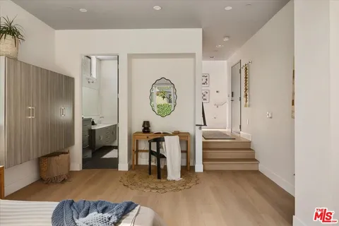 a living room with furniture and a clock