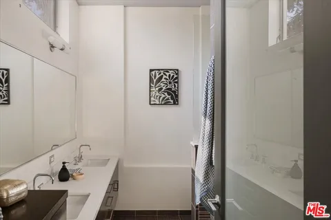 a bathroom with a sink and a bathtub