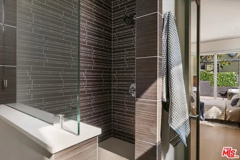 a view of potted plant in front of a bathroom