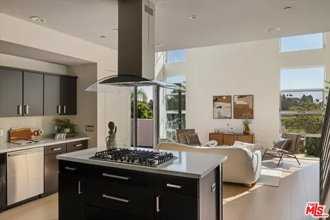 a kitchen with a stove and a sink