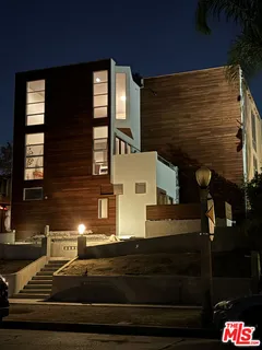 a view of a house with a street