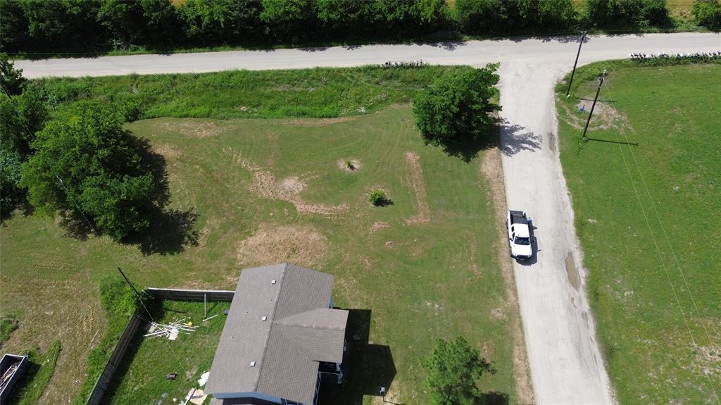 Tbd Telegraph Road Quinlan, TX 75474 - Photo 7 of 14 an aerial view of a house with a yard and lake view