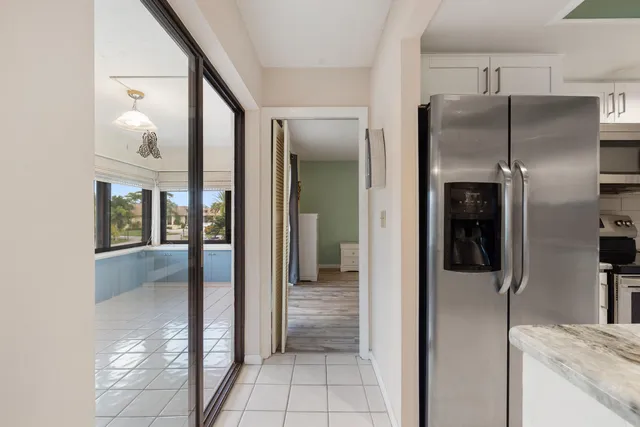 a view of a kitchen from the hallway
