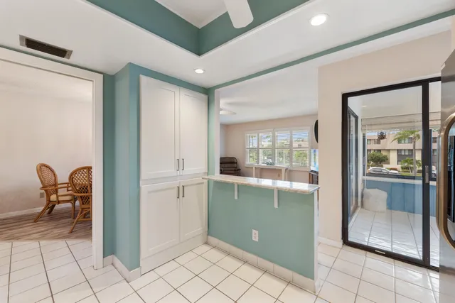 a view of a room with wooden floor and windows
