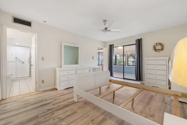 a bathroom with a toilet a sink and a mirror