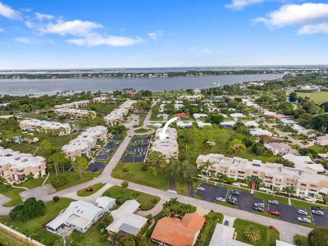 an aerial view of residential building and lake