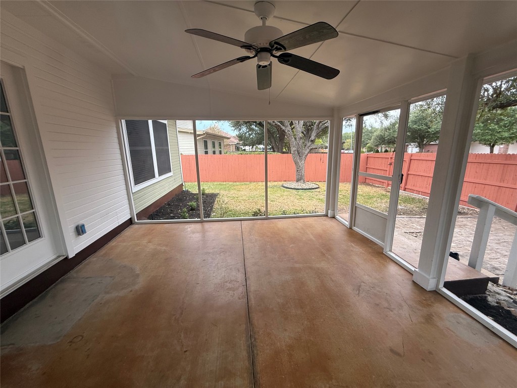 11711 Rydalwater Lane Austin, TX 78754 - Photo 17 of 20 Unfurnished sunroom featuring ceiling fan and vaulted ceiling