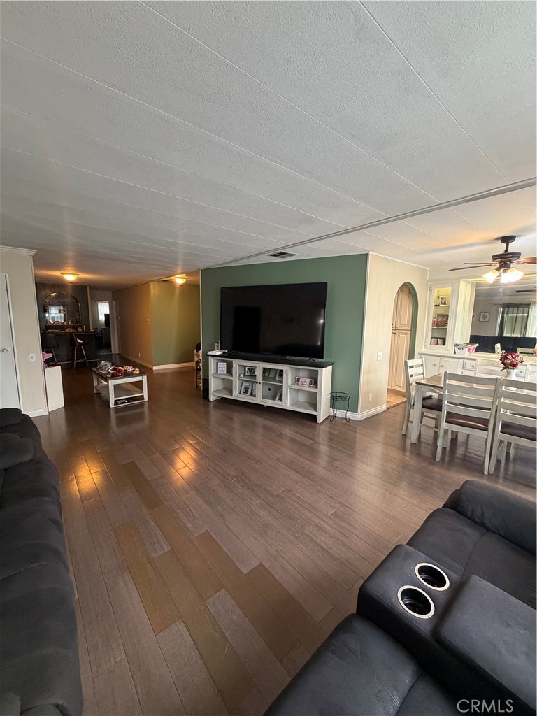 300 North Rampart Street, Unit 182 Orange, CA 92868 - Photo 3 of 14 a living room with furniture and a flat screen tv