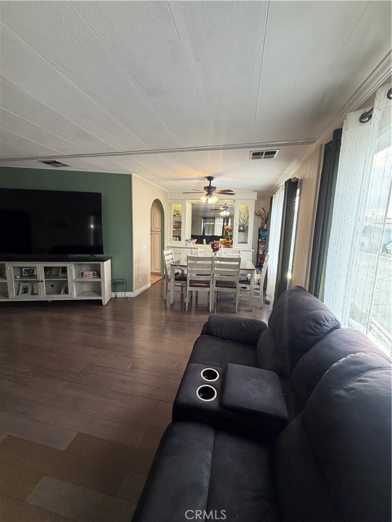 300 North Rampart Street, Unit 182 Orange, CA 92868 - Photo 4 of 14 a living room with furniture and a flat screen tv