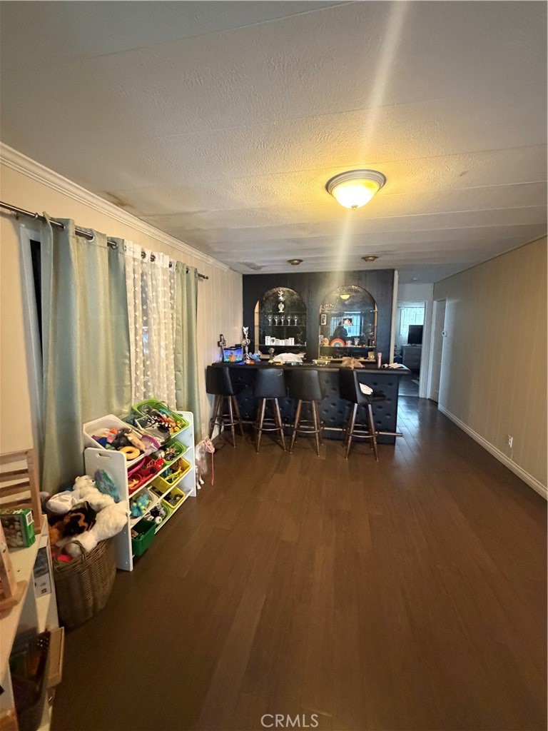 300 North Rampart Street, Unit 182 Orange, CA 92868 - Photo 6 of 14 a living room with furniture pool table and a flat screen tv