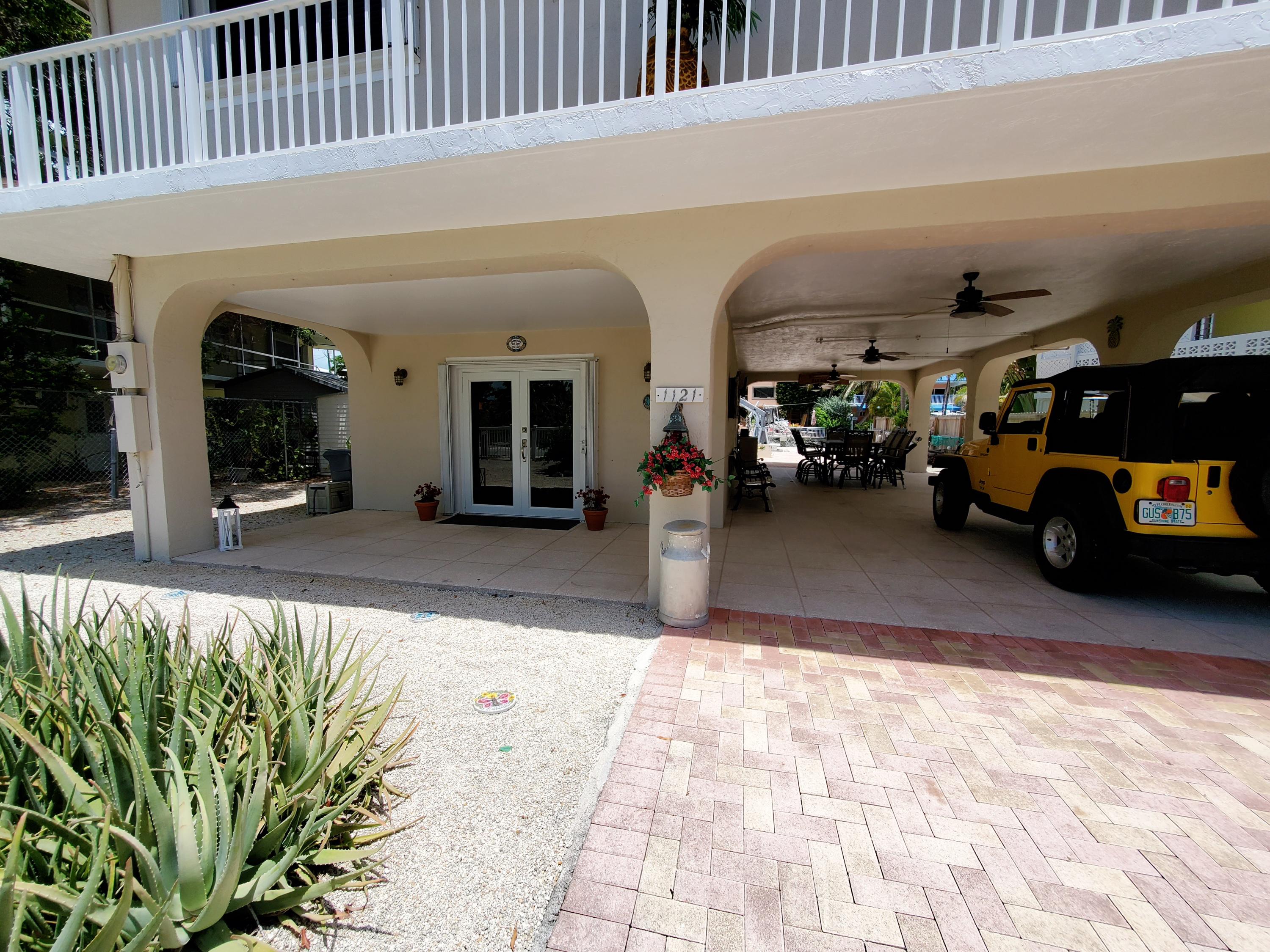 1121 Heron Road Key Largo, FL 33037 - Photo 8 of 45 Breezeway with covered entrance