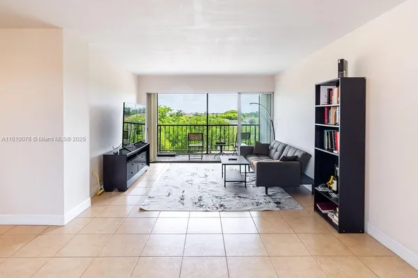 a view of a city from a balcony with furniture