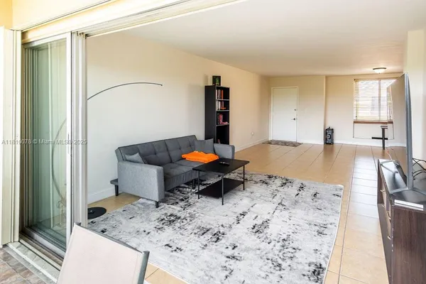 a living room with furniture and flat screen tv