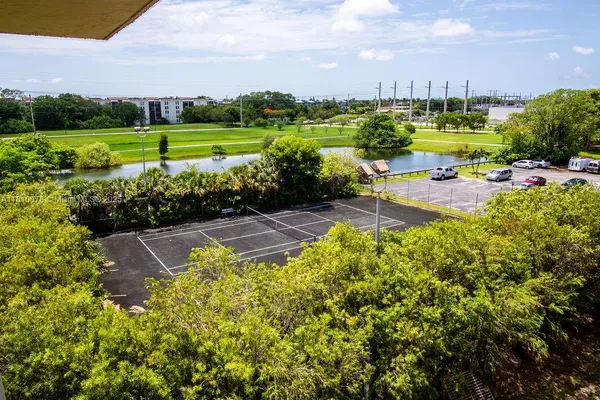 a view of a house with swimming pool and sitting area