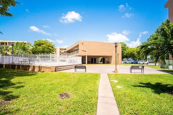 a view of a swimming pool with lounge chairs