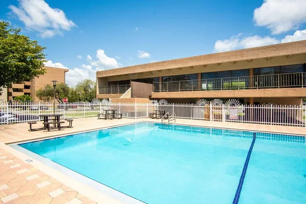a view of a parked cars in front of a building