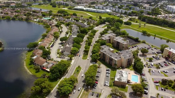an aerial view of residential houses with outdoor space