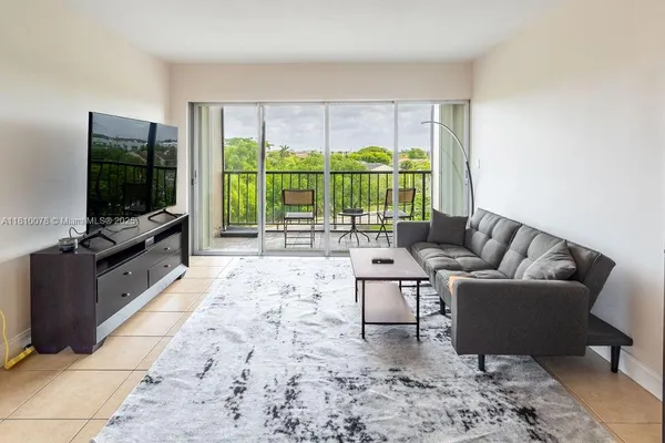 a view of a living room and dining room