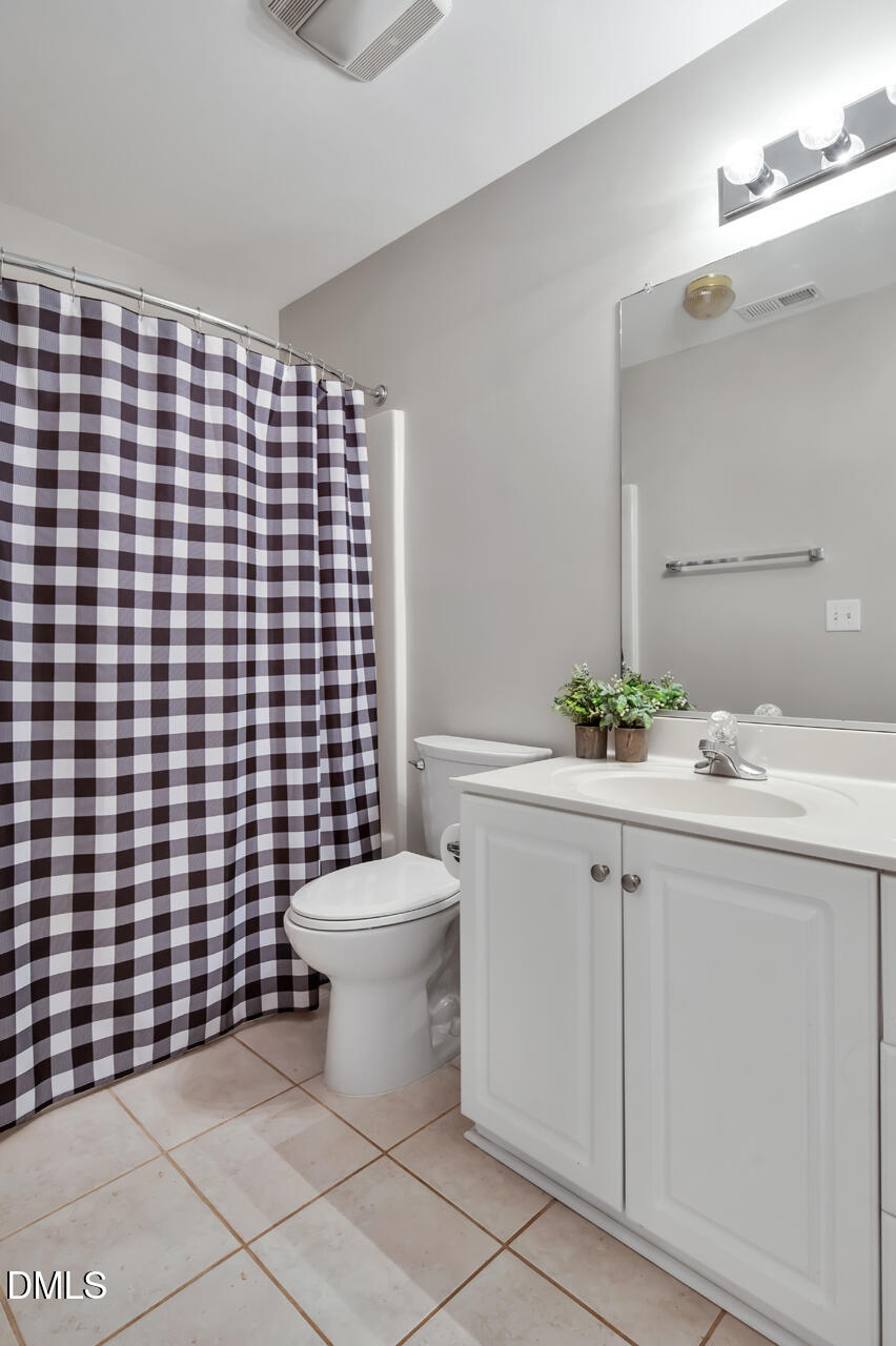 2021 Rivergate Road, Unit 103 Raleigh, NC 27614 - Photo 23 of 27 Primary Bath To The Left Of Stairs