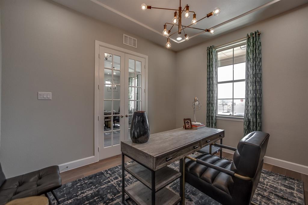 1437 Sun Gdn Way Justin, TX 76247 - Photo 21 of 28 a view of a dining room with furniture window and wooden floor