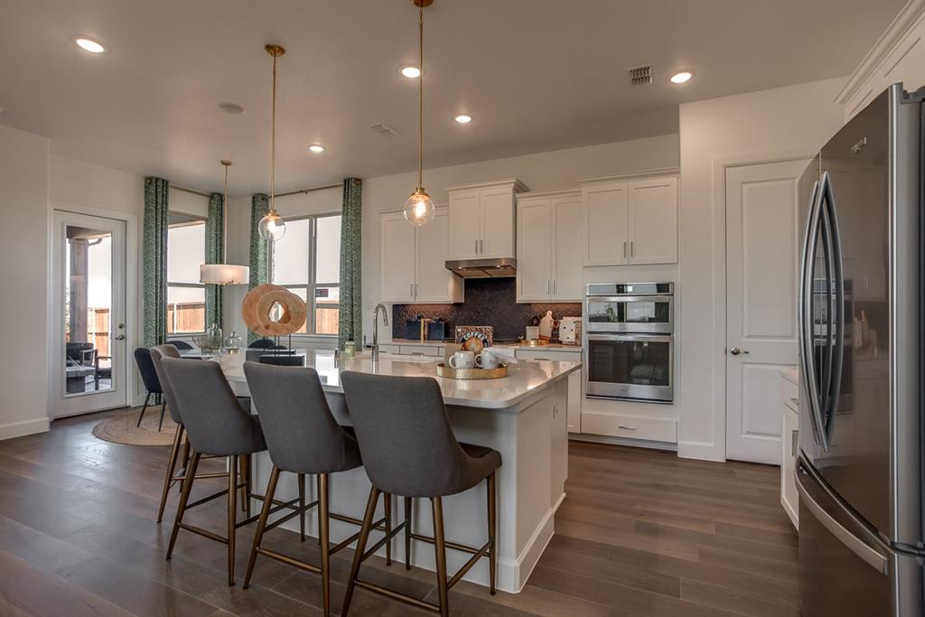 1437 Sun Gdn Way Justin, TX 76247 - Photo 5 of 28 a view of a dining room with furniture window and wooden floor