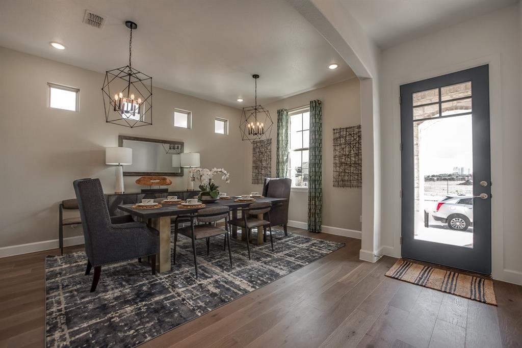 1437 Sun Gdn Way Justin, TX 76247 - Photo 8 of 28 a view of a dining room with furniture window and wooden floor