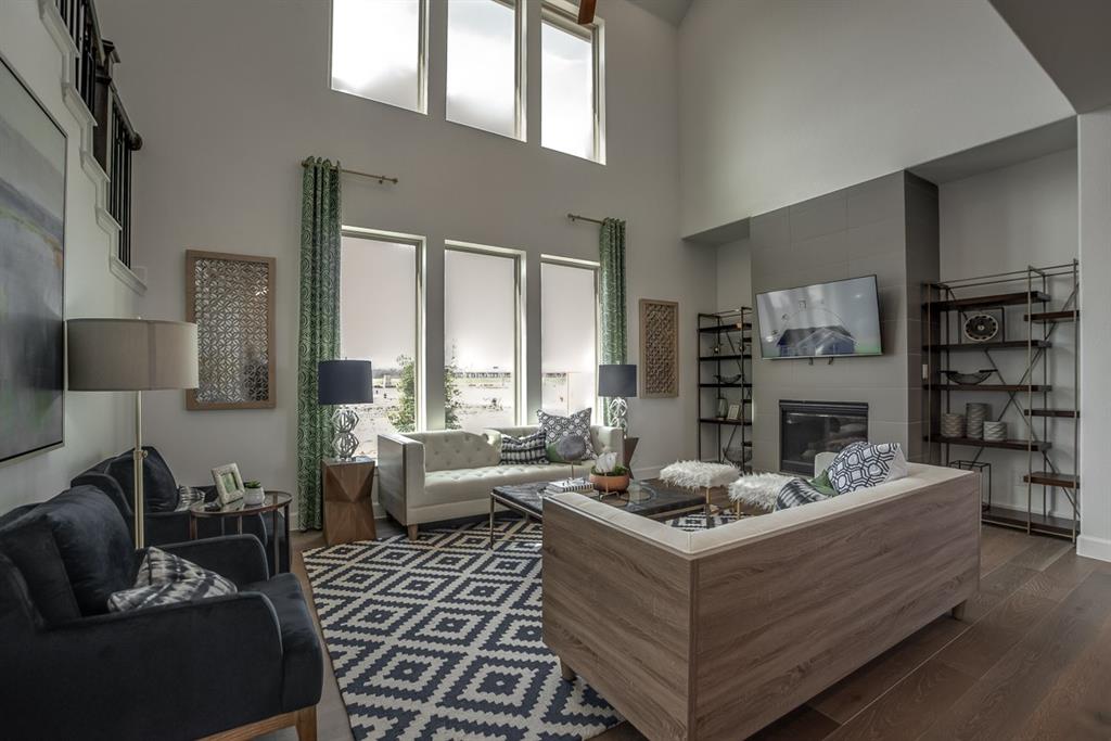 1437 Sun Gdn Way Justin, TX 76247 - Photo 11 of 28 a living room with furniture fireplace and a large window
