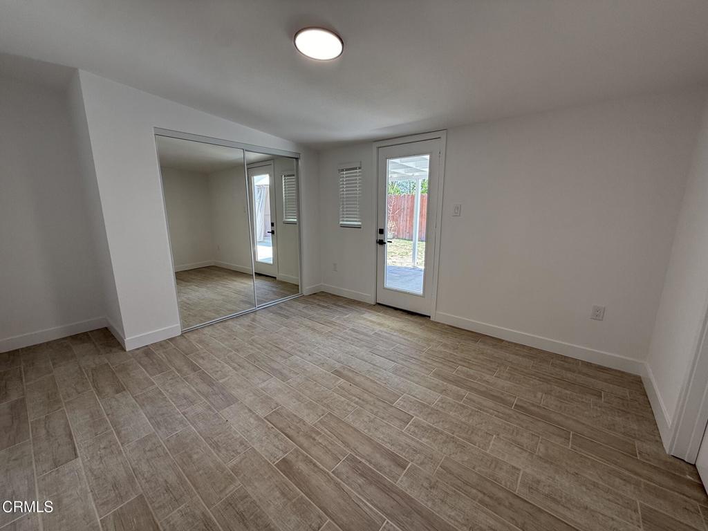 4010 Witt Avenue Riverside, CA 92501 - Photo 11 of 23 an empty room with wooden floor and windows