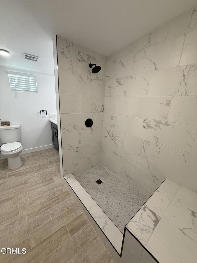 4010 Witt Avenue Riverside, CA 92501 - Photo 12 of 23 a bathroom with a shower and toilet